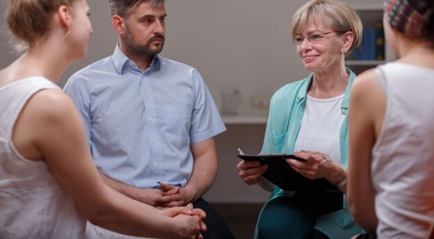 Addiction Management people sitting in a circle in a support group
