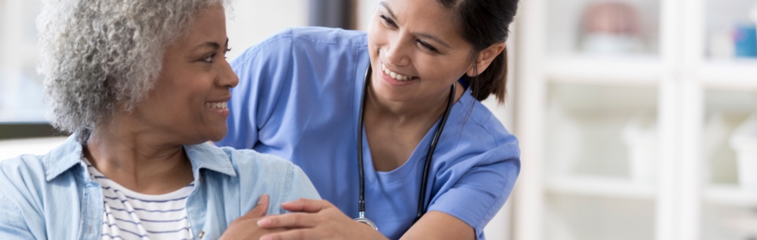 Doctor smiling with patient